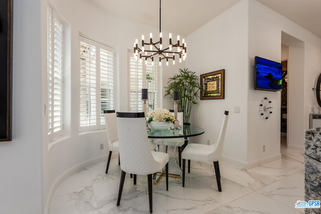 53 Vista Encantada Rancho Mirage, CA 92270 - Photo 12 of 33 a view of a dining room with furniture and a chandelier