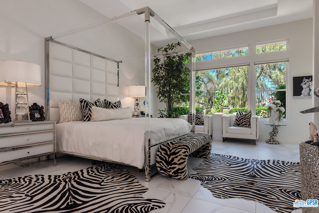53 Vista Encantada Rancho Mirage, CA 92270 - Photo 13 of 33 a bedroom with a large bed and a window