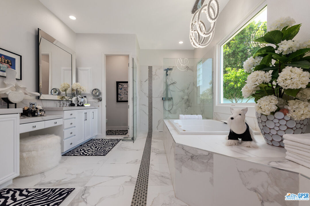 53 Vista Encantada Rancho Mirage, CA 92270 - Photo 15 of 33 a bathroom with a sink a toilet and shower