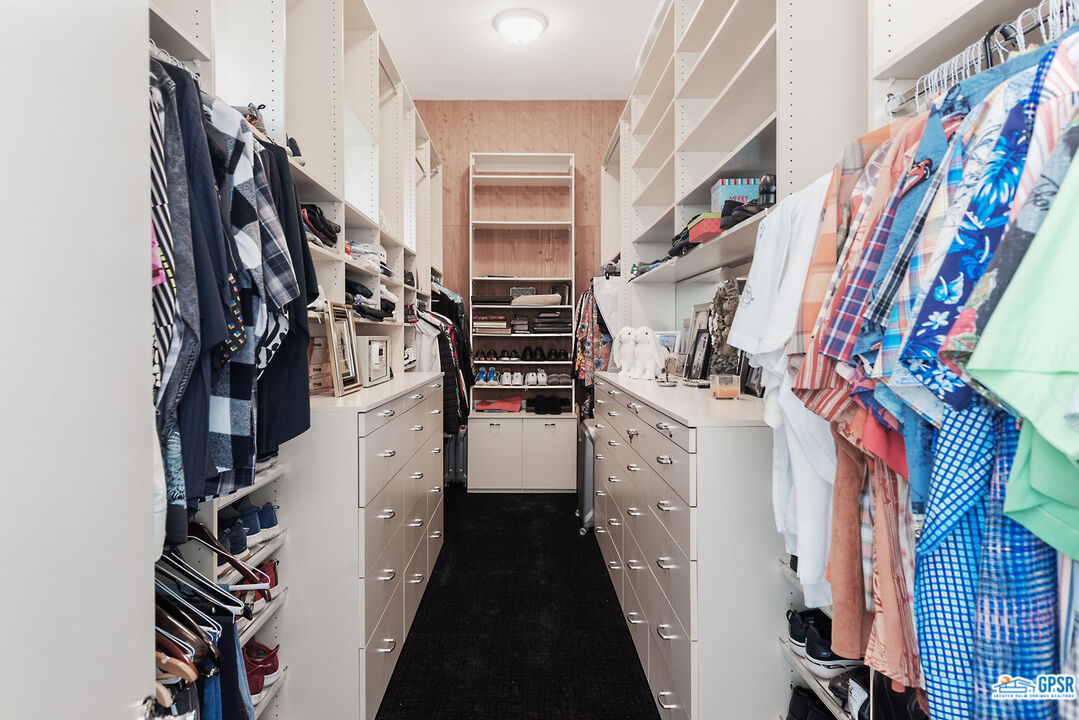 53 Vista Encantada Rancho Mirage, CA 92270 - Photo 17 of 33 a view of walk in closet with clothes and shoes