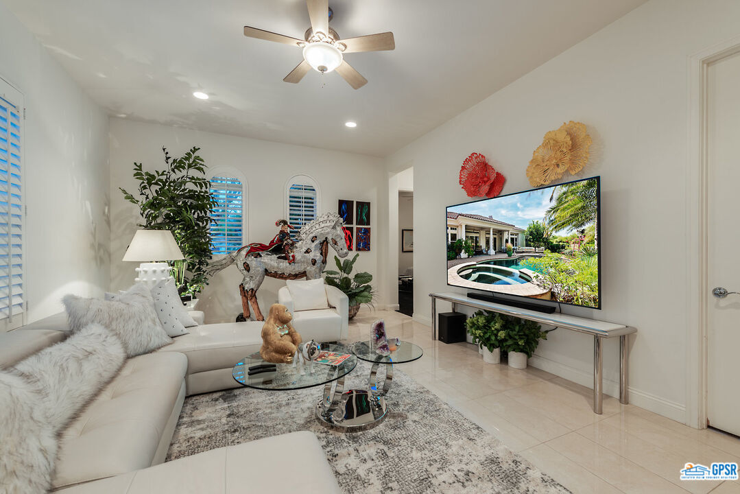 53 Vista Encantada Rancho Mirage, CA 92270 - Photo 18 of 33 a living room with furniture a window and a flat screen tv