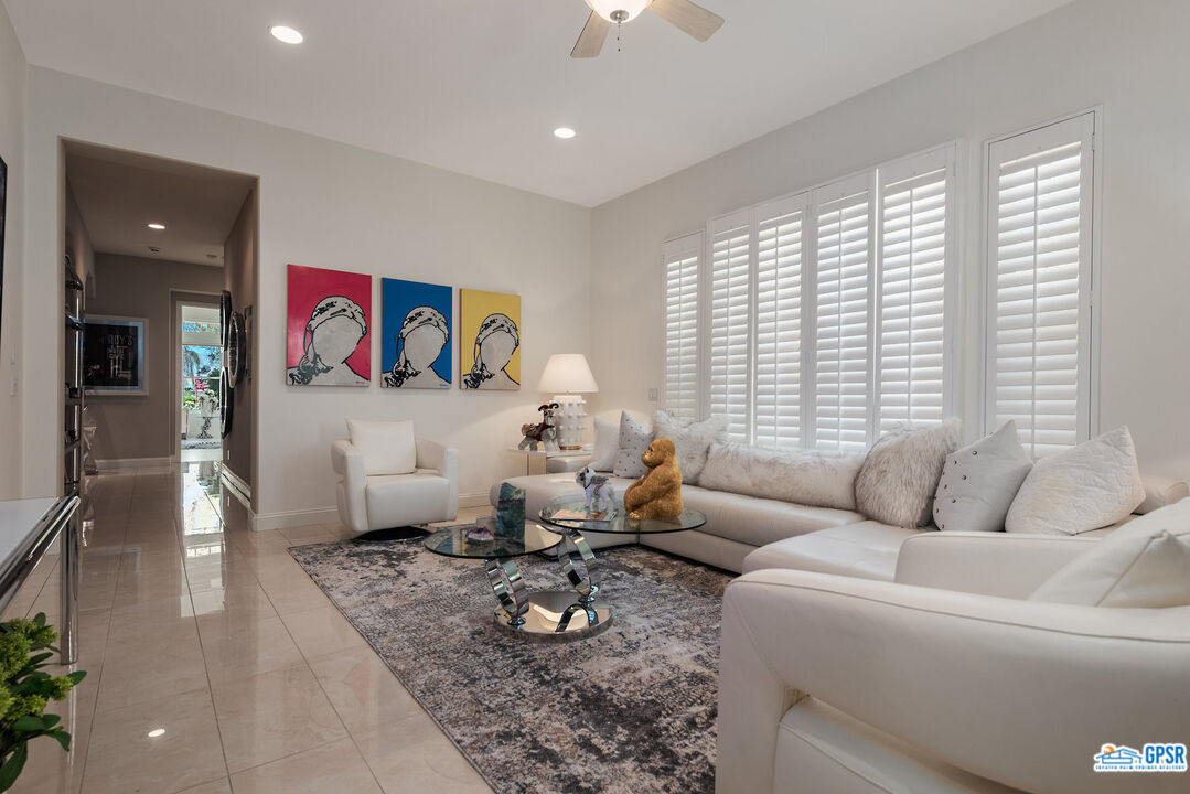 53 Vista Encantada Rancho Mirage, CA 92270 - Photo 19 of 33 a living room with furniture and a large window