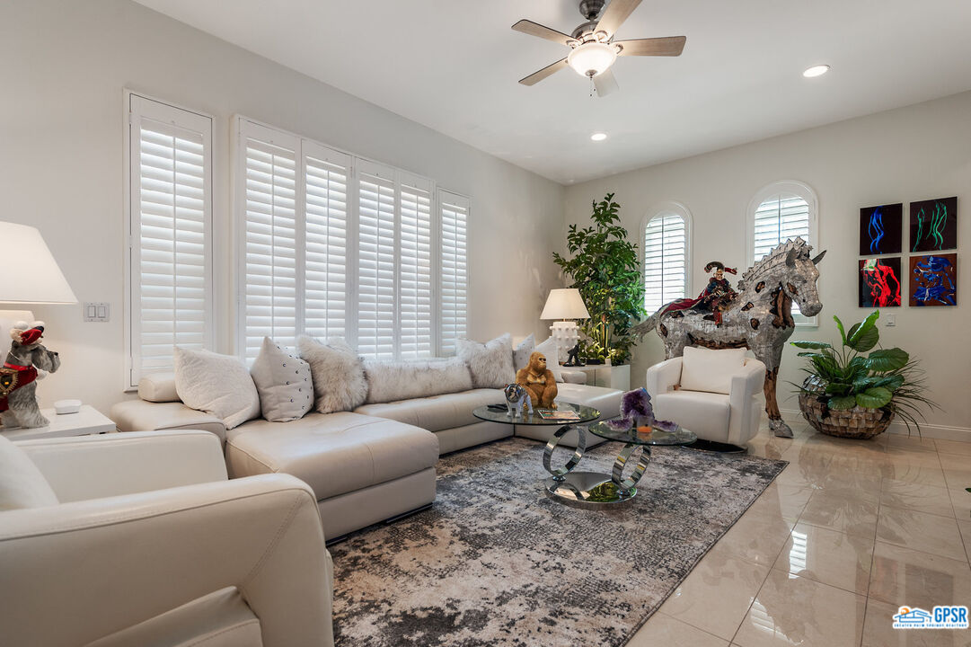 53 Vista Encantada Rancho Mirage, CA 92270 - Photo 20 of 33 a living room with furniture and a large window