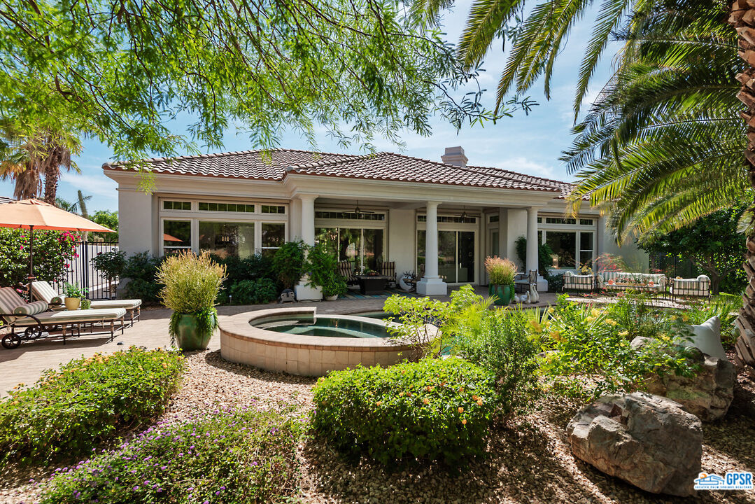 53 Vista Encantada Rancho Mirage, CA 92270 - Photo 23 of 33 a front view of a house with garden
