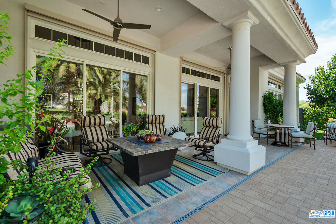 53 Vista Encantada Rancho Mirage, CA 92270 - Photo 26 of 33 a outdoor space with patio the couches and a dining table with chairs