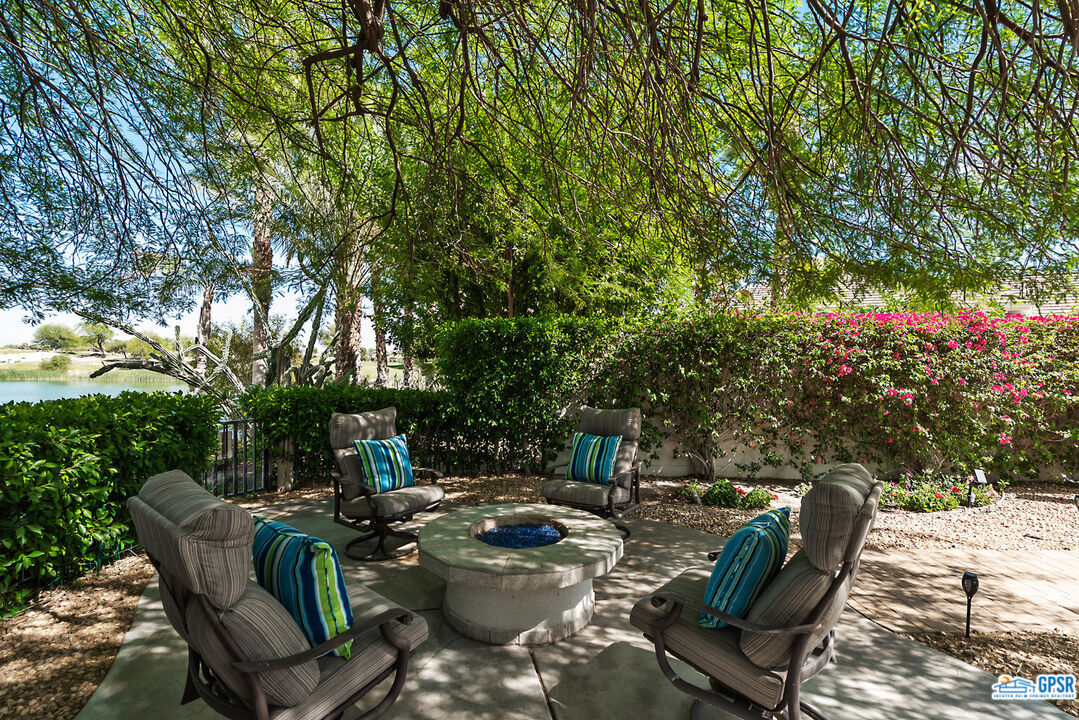 53 Vista Encantada Rancho Mirage, CA 92270 - Photo 31 of 33 a view of backyard with swimming pool and seating space