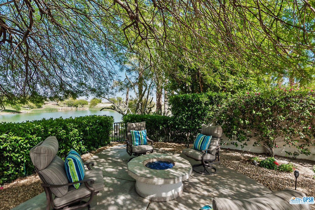 53 Vista Encantada Rancho Mirage, CA 92270 - Photo 32 of 33 a backyard of a house with table and chairs