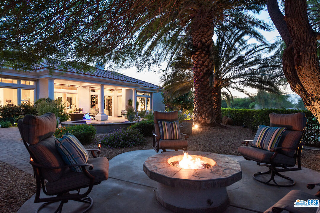 53 Vista Encantada Rancho Mirage, CA 92270 - Photo 33 of 33 a outdoor space with chairs and a fireplace