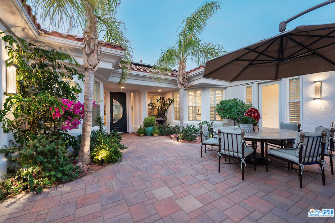 53 Vista Encantada Rancho Mirage, CA 92270 - Photo 4 of 33 a view of a chair and table in backyard of the house