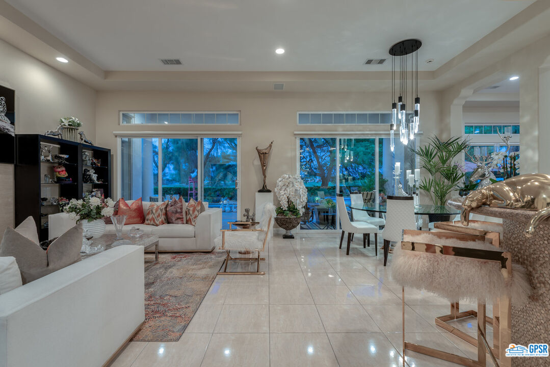 53 Vista Encantada Rancho Mirage, CA 92270 - Photo 5 of 33 a living room with furniture and a large window