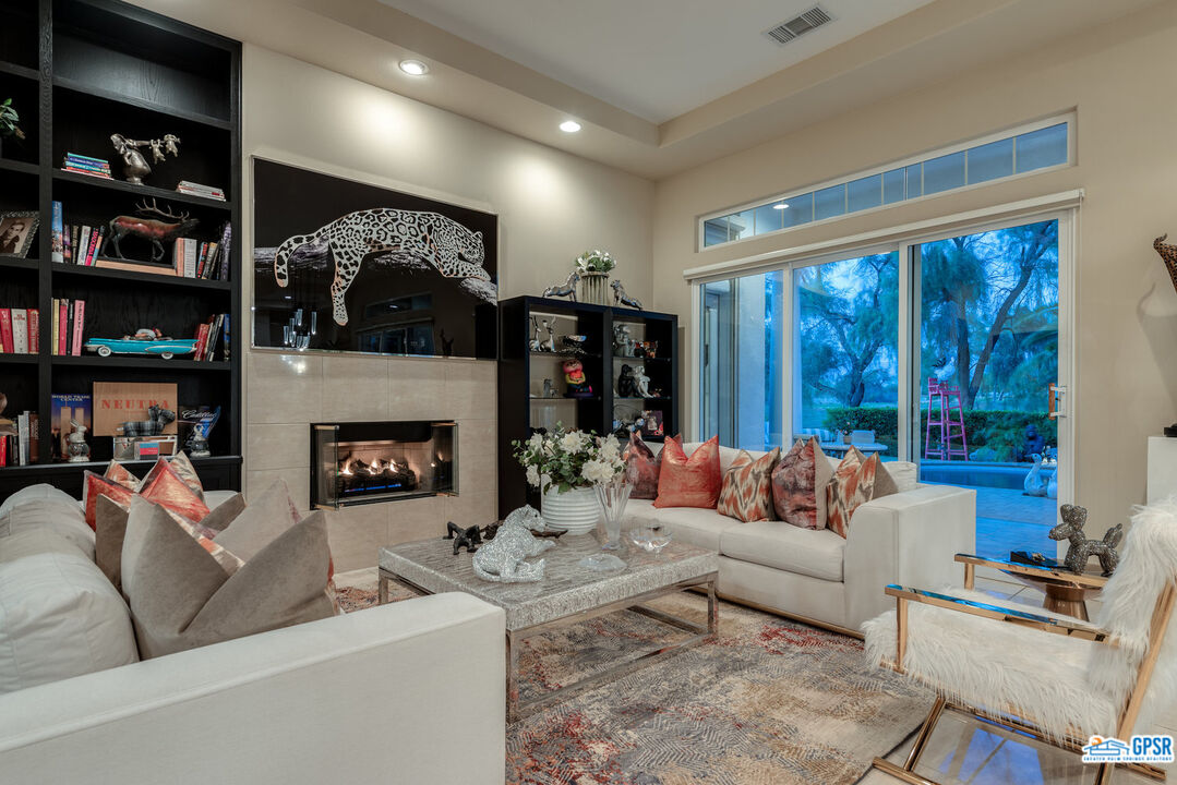 53 Vista Encantada Rancho Mirage, CA 92270 - Photo 7 of 33 a living room with furniture and a fireplace