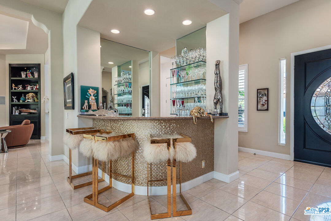 53 Vista Encantada Rancho Mirage, CA 92270 - Photo 10 of 33 a dining hall with stainless steel appliances granite countertop a table and chairs