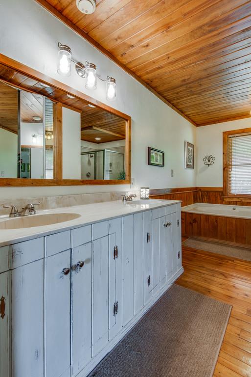 790 High Point Ridge Road Franklin, TN 37069 - Photo 14 of 30 a spacious bathroom with a double vanity sink and a large mirror