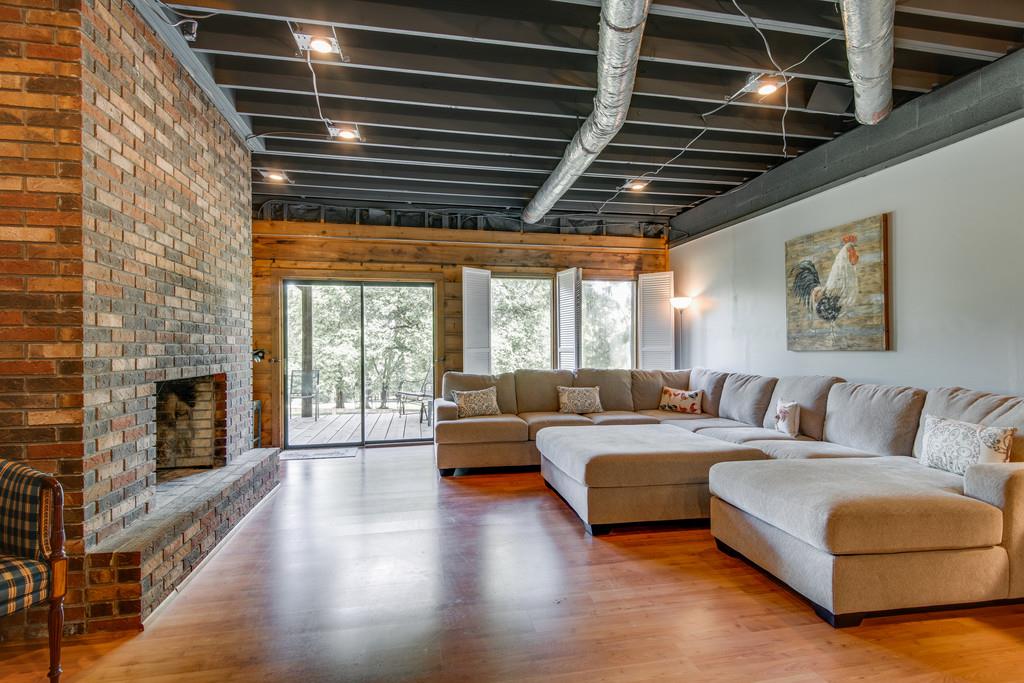 790 High Point Ridge Road Franklin, TN 37069 - Photo 23 of 30 a living room with furniture and a fireplace