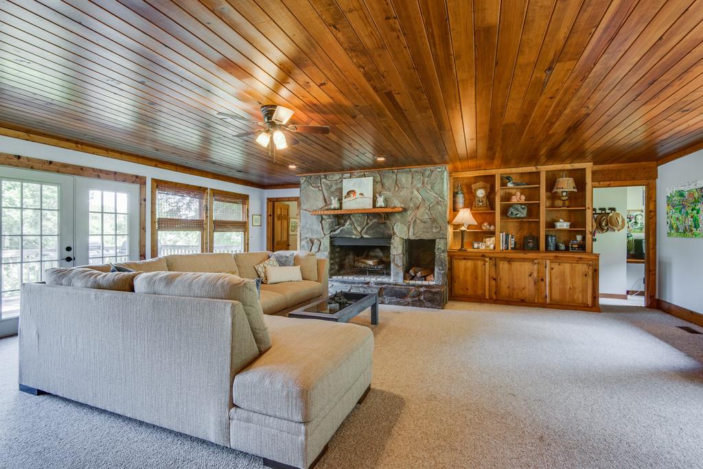 790 High Point Ridge Road Franklin, TN 37069 - Photo 7 of 30 a living room with furniture a fireplace and a large window