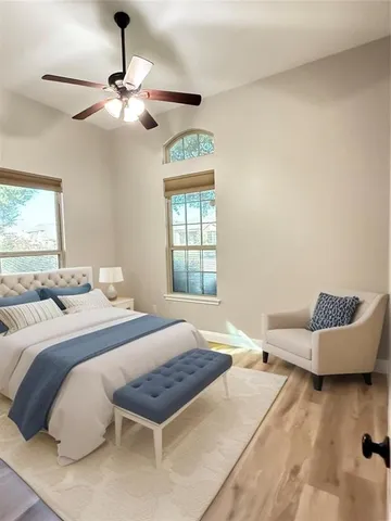 a bedroom with a bed and window