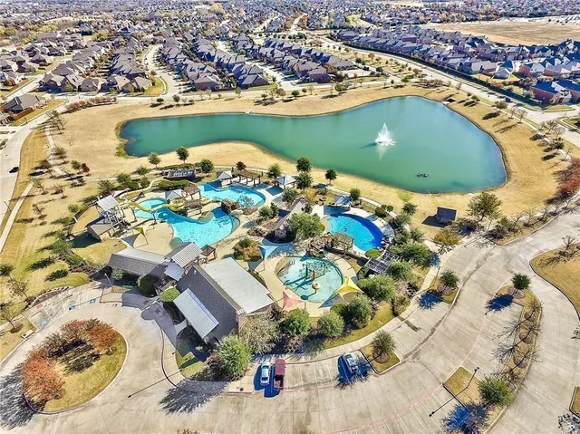 an aerial view of a house with a lake view