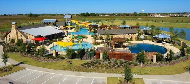 an aerial view of houses with outdoor space