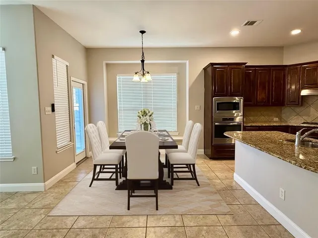 a view of a dining room with furniture