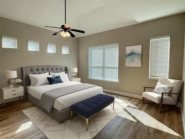 a bedroom with bed couch and window