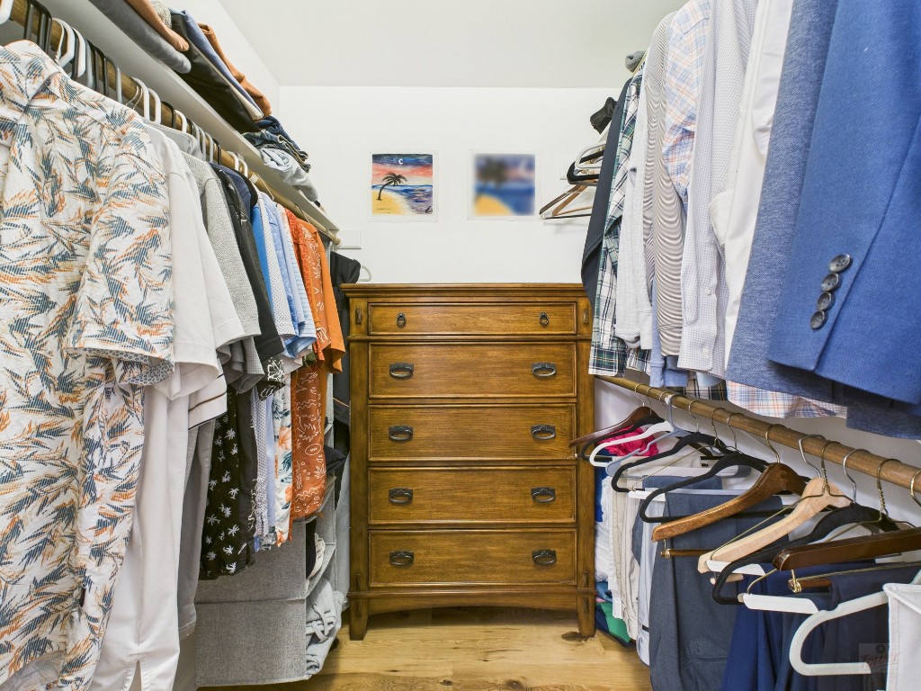 2529 Rio Grande Street, Unit 24 Austin, TX 78705 - Photo 11 of 15 a view of walk in closet with clothes