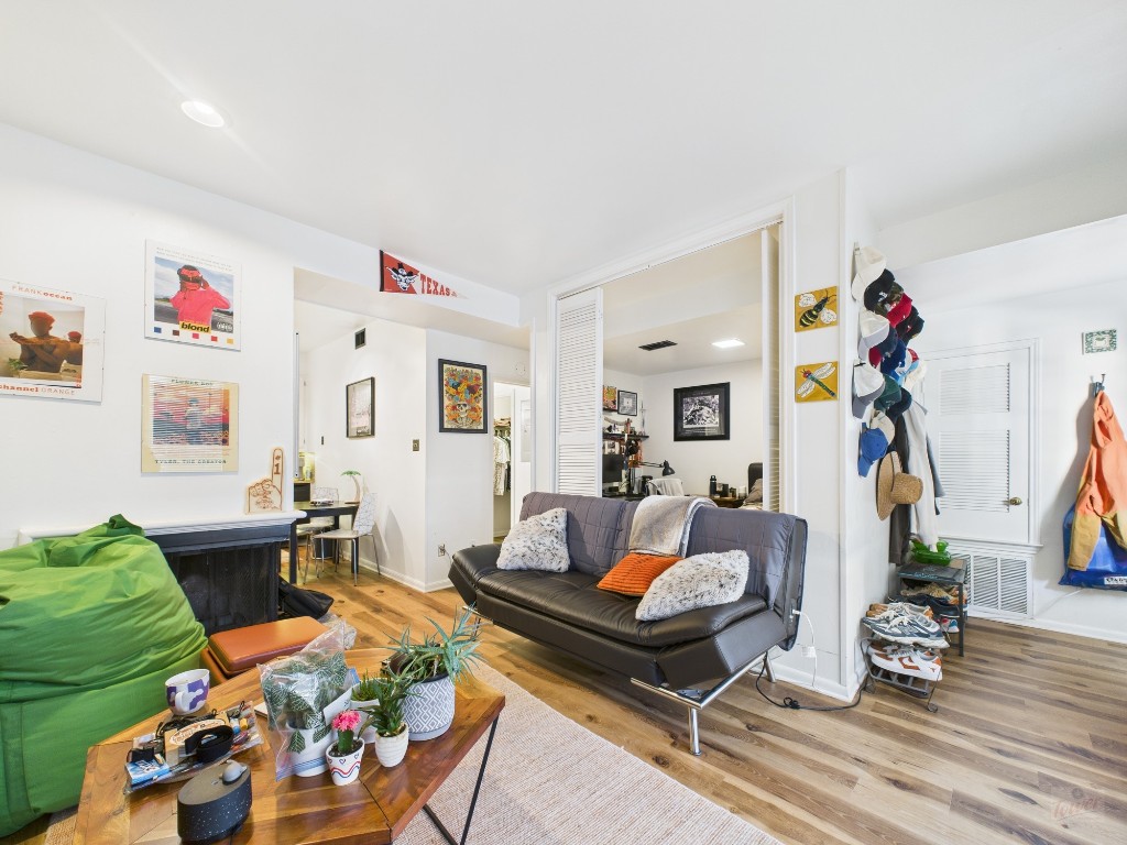 2529 Rio Grande Street, Unit 24 Austin, TX 78705 - Photo 2 of 15 a living room with furniture and wooden floor