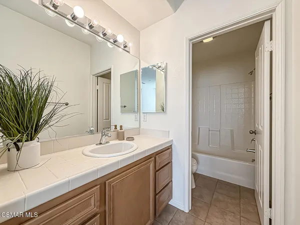 a utility room with cabinets washer and dryer