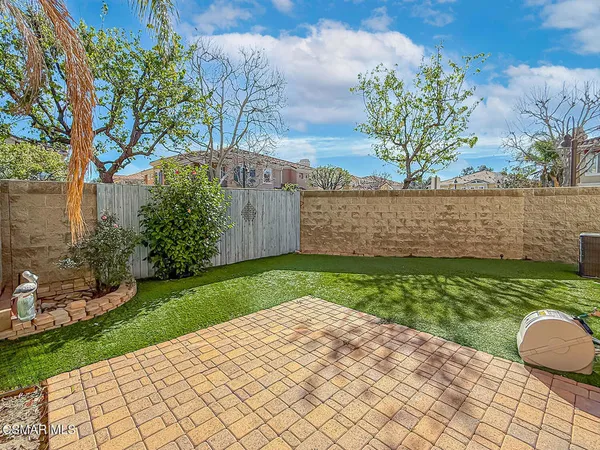 a view of a backyard with a garden