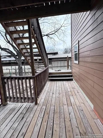 a view of wooden balcony with wooden floor and fence