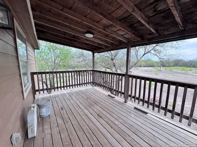 a bedroom with bed and a chandelier