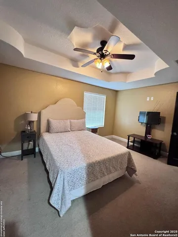 a view of a refrigerator and a stove in a room
