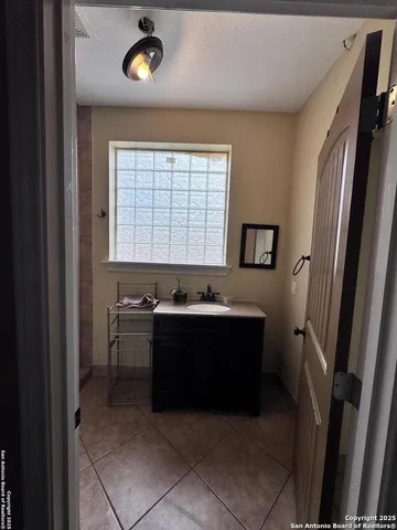 a bathroom with a sink and a mirror
