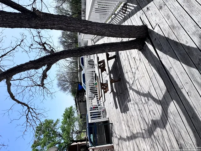 a view of balcony with wooden floor