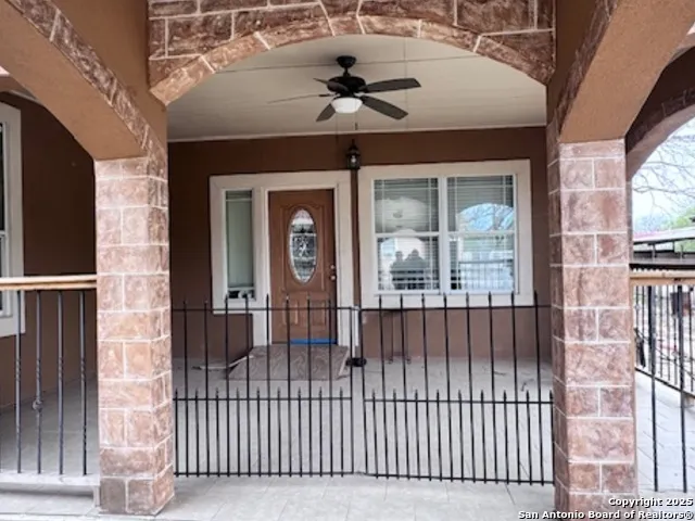 a view of a brick house with a large window