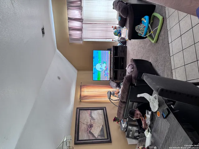 a room with furniture and book shelf