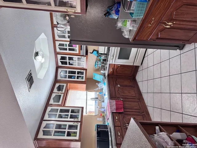 a view of balcony with wooden floor and stairs