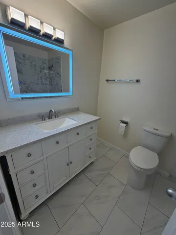 a bathroom with a toilet and a bathtub