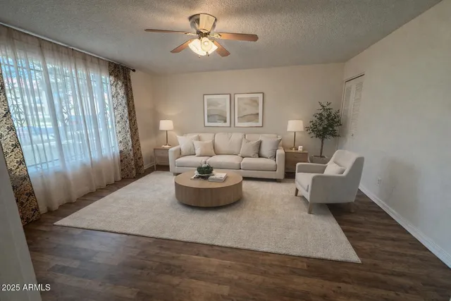 a living room with furniture and a window
