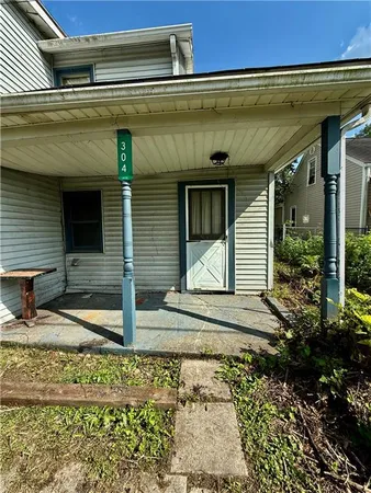 a view of a house with a back yard