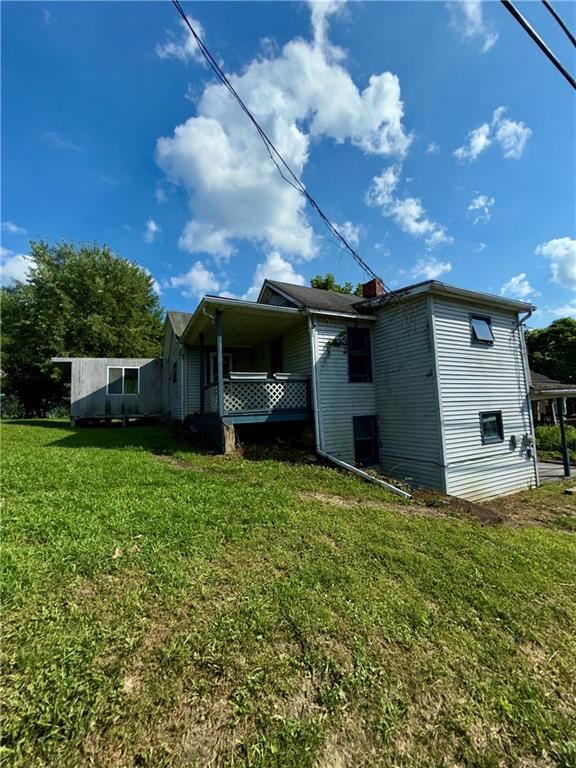 304 Narrows Road Connellsville, PA 15425 - Photo 3 of 13 a view of a house with a back yard