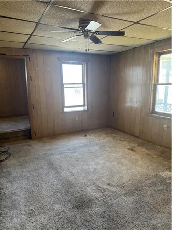 a room with a window and a fireplace