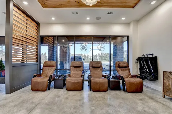 a lobby with furniture and large windows