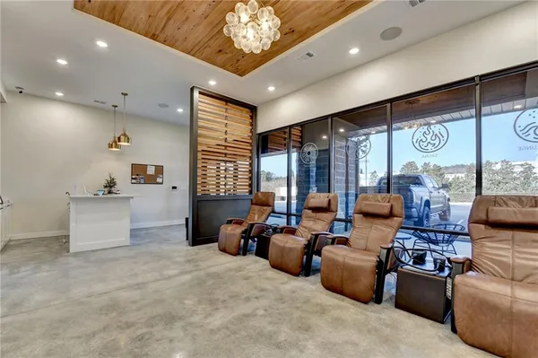 a living room with furniture and large window