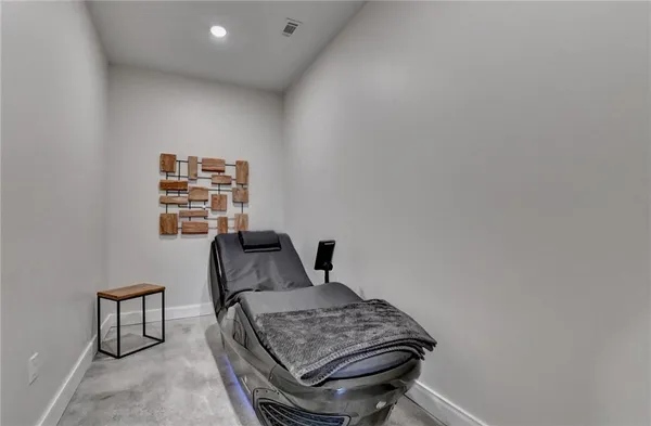 a view of a workspace with furniture and wooden floor