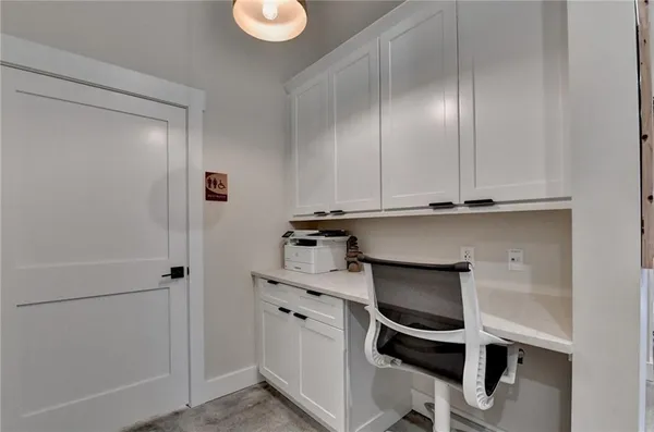 a living room with furniture and a mirror