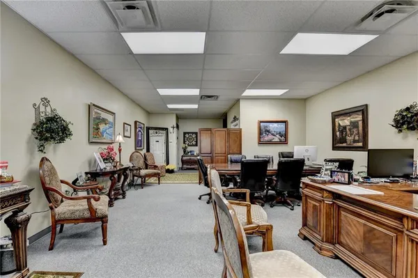 a front view of a house with a yard and a garage