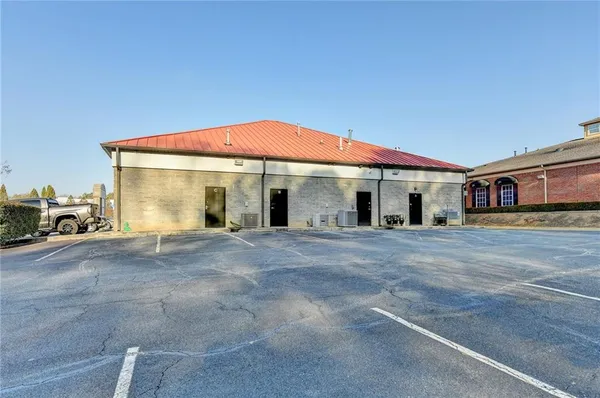 a view of a backyard with large trees