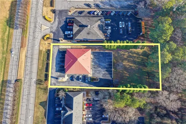 an aerial view of a house with swimming pool