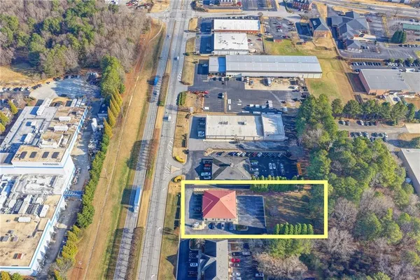 an aerial view of a house with entertaining space