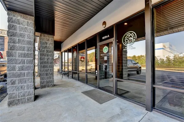 a view of a porch with a table and chairs